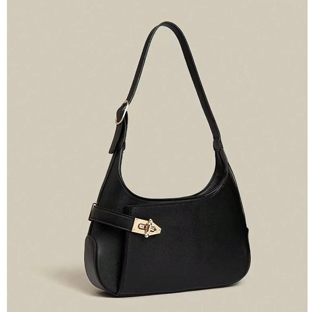 Minimalist black hobo shoulder bag gold hardware under arm‎